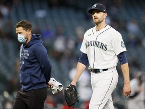 Mariners pitcher James Paxton is taken out of the game with an injury in the second inning against the White Sox at T-Mobile Park in Seattle, April 6, 2021.