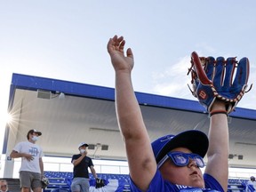 Fans get settled in prior to the start of the game between the Blue Jays and Angels on Thursday. It was the "home opener" for the Jays, who are playing their home matches in Dunedin for now. GETTY IMAGES