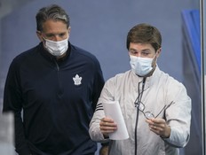 Brendan Shanahan and Kyle Dubas take in the practice at Maple Leafs training camp. Dubas, the team's general manager, deserves credit for going all-in at the trade deadline, writes Michael Traikos.