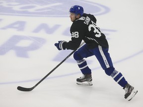 Maple Leafs' Rasmus Sandin heads up through centre ice at a practice in Toronto.