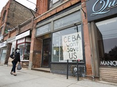 A closed store front boutique business called Francis Watson pleads for help displaying a sign in Toronto on Thursday, April 16, 2020.