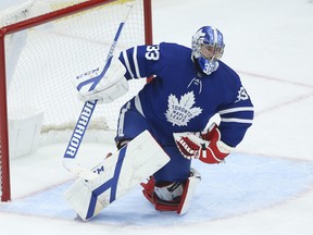 Toronto Maple Leafs goalie David Rittich makes a glove save during the second period against his former team the Calgary Flames in Toronto on Tuesday, April 13, 2021.