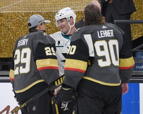 Sharks forward Patrick Marleau (centre) is congratulated by members of the Vegas Golden Knights after he played in his 1,768th NHL game, breaking Gordie Howe’s record for career NHL games played. GETTY IMAGES