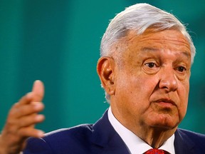 Mexico's President Andres Manuel Lopez Obrador gestures as he speaks during a news conference at the National Palace, in Mexico City, March 24, 2021.