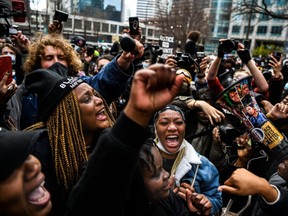 People celebrate as the verdict is announced in the trial of former police officer Derek Chauvin outside the Hennepin County Government Center in Minneapolis, Minn., Tuesday, April 20, 2021.