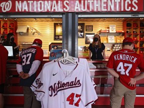 Fans shop for merchandise before the Nationals 2021 Opening Day game against the Braves at Nationals Park in Washington, D.C., Tuesday, April 6, 2021.