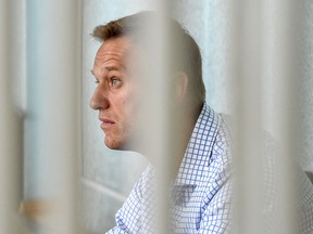 In this file photo taken on June 24, 2019 Russian opposition leader Alexei Navalny attends a hearing at a court in Moscow.