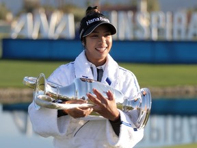 Patty Tavatanakit of Thailand poses with the trophy after winning the ANA Inspiration at the Dinah Shore course at Mission Hills Country Club on April 4, 2021 in Rancho Mirage, Calif.