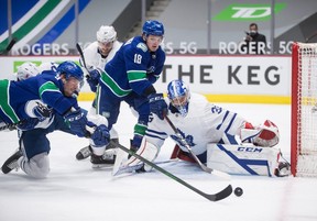 Leafs goalie David Rittich makes a stop against the Vancouver Canucks on Tuesday night. The Leafs are in serious trouble if they need to rely heavily on the shaky goaltender in the playoffs. THE CANADIAN PRESS