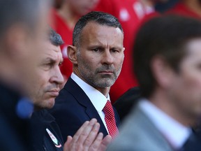 In this file photo taken on March 24, 2019 Wales' manager Ryan Giggs awaits kickoff in the UEFA Euro 2020 qualification match against Slovakia at Cardiff City Stadium in Cardiff.