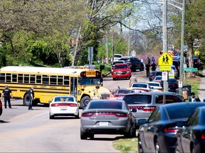 Police attend a shooting at Austin-East Magnet High School in Knoxville, Tenn., April 12, 2021.