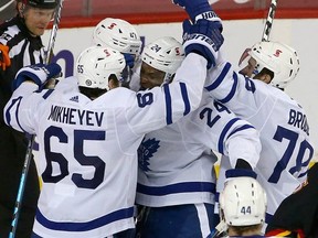 Wayne Simmonds is mobbed by teammates after scoring a goal in the Maple Leafs 5-3 win over Calgary on Monday night.