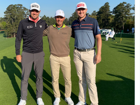 From left, Corey Conners, Mike Weir and Mackenzie Hughes are all smiles during a practice round at the Masters yesterday.