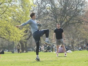 People play soccer at Trinity Bellwoods Park.
