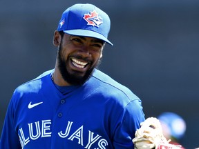 Toronto Blue Jays' Teoscar Hernandez has some fun before the start of the game against the Baltimore Orioles during spring training at TD Ballpark in Dunedin, Fla., March 5, 2021.