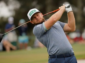 England's Tyrrell Hatton hits his tee shot on the third hole during the second round of The Masters, at Augusta National Golf Club in Augusta, Ga., April 9, 2021.