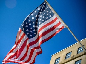 The U.S. Stars and Stripe flags with 51 stars (an extra star for the District of Columbia) are set up on poles on Black Lives Matter Plaza next to the White House on March 22, 2021 in Washington, D.C.