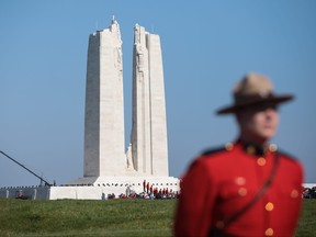 A member of the Royal Canadian Mounted Police stands in front of the Canadian National Vimy Memorial on April 9, 2017 in Vimy, France.