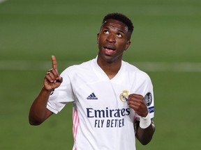 Vinicius Junior of Real Madrid celebrates after scoring during his team's UEFA Champions League quarterfinal match against Liverpool FC at Estadio Alfredo Di Stefano on April 6, 2021 in Madrid, Spain.