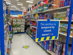An aisle of non-essential goods is cordoned off at a Walmart store, as new measures are imposed on big-box stores due to the COVID-19 pandemic, in Toronto, Ont. on April 8, 2021.