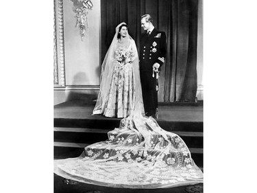 In this file photo taken on Nov. 20, 1947, Princess Elizabeth (future Queen Elizabeth II) and Philip, Duke of Edinburgh, pose on their wedding day at Buckingham Palace in London
