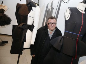 In this file photo taken on September 08, 2015 in Paris, artistic director of the Couture house Lanvin, designer Alber Elbaz, poses during the exhibition "Manifesto" dedicated to his work.