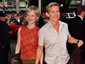 Actresses Anne Heche (L) and Ellen DeGeneres hold arrive as guests for the premiere of "Face/Off," starring John Travolta and Nicolas Cage, in Hollywood June 19.