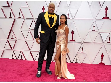 Travon Free and Zaria Simone arrive to the Oscars red carpet for the 93rd Academy Awards, at Union Station, in Los Angeles, California, U.S., April 25, 2021. Chris Pizzello/Pool via REUTERS ORG XMIT: OSC