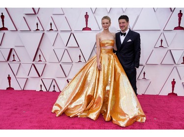 Carey Mulligan, left, and Marcus Mumford arrive to the Oscars red carpet for the 93rd Academy Awards, at Union Station, in Los Angeles, California, U.S., April 25, 2021. Chris Pizzello/Pool via REUTERS ORG XMIT: OSC