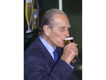 Prince Philip, the Duke of Edinburgh, sips from a glass of Boag beer as he visits the brewery in Launceston March 29, 2000.