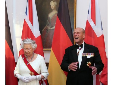 Queen Elizabeth and Prince Philip wait to greet guests prior to a state banquet at Bellevue presidential palace in Berlin, Germany June 24, 2015.