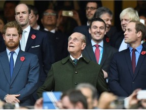 Britain's Prince Harry, Prince Philip and Prince William (L-R) attend the Rugby World Cup final match between New Zealand against Australia at Twickenham in London, Britain October 31, 2015.