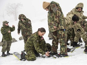 Cpl. Brenna Baverstock of the Winter Mobile Training Team conducts a snowshoe lesson for the soldiers of the Lebanon Border Regiment in the Bcharre region of Lebanon, on February 17, 2020.