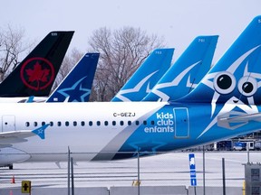 Air Transat and an Air Canada aircrafts are seen on the tarmac at Montreal-Trudeau International Airport in Montreal, on Wednesday, April 8, 2020.