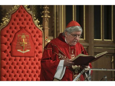 Cardinal Thomas Collins of the Roman Catholic Archdiocese of Toronto delivers the Good Friday liturgy at St. Michael's Cathedral Basilica. The church capacity could only be at  15% for parishioners as COVID rules still apply to places of worship on Friday April 2, 2021. Jack Boland/Toronto Sun/Postmedia Network