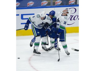 Toronto Maple Leafs John Tavares C (91) highsticksVancouver Canucks Nils Hoglander LW (36) during the first period in Toronto on Thursday April 29, 2021. Jack Boland/Toronto Sun/Postmedia Network