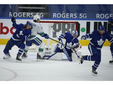 Vancouver Canucks Brock Boeser LW (6) watches the puck get past Toronto Maple Leafs David Rittich G (33) on a power-play goal by teammate J.T. Miller during the second period in Toronto on Thursday April 29, 2021. Jack Boland/Toronto Sun/Postmedia Network