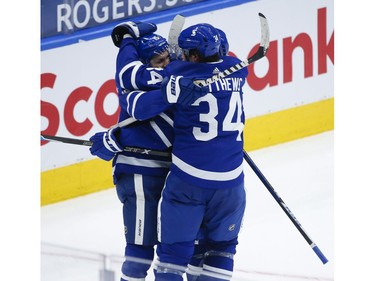 Toronto Maple Leafs Mitch Marner RW (16) scores after capitalizing on Vancouver Canucks Braden Holtby G (49) giveaway with teammate TAlexander Kerfoot C (15) during the third period in Toronto on Thursday April 29, 2021. Jack Boland/Toronto Sun/Postmedia Network