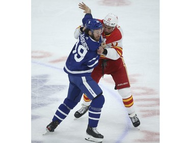 Calgary Flames Milan Lucic LW (17) fights Toronto Maple Leafs Scott Sabourin RW (49) during the first period in Toronto. It is Lucic's 100th game as a player  on Tuesday April 13, 2021. Jack Boland/Toronto Sun/Postmedia Network