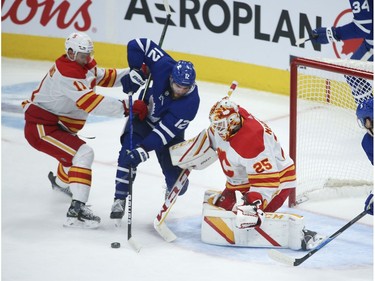 Calgary Flames Jacob Markstrom G (25) makes a save on Toronto Maple Leafs Alex Galchenyuk C (12) during the second period in Toronto on Tuesday April 13, 2021. Jack Boland/Toronto Sun/Postmedia Network
