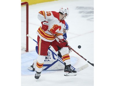 Calgary Flames Matthew Tkachuk LW (19) screens Toronto Maple Leafs David Rittich G (33) on a shot during the second period in Toronto on Tuesday April 13, 2021. Jack Boland/Toronto Sun/Postmedia Network