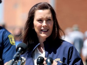 Michigan Governor Gretchen Whitmer addresses the media about the flooding along the Tittabawassee River, after several dams breached, in downtown Midland, Michigan, U.S., May 20, 2020.