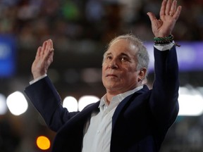 Singer Paul Simon greets the audience while performing at the Democratic National Convention in Philadelphia, Pennsylvania, U.S., July 25, 2016.