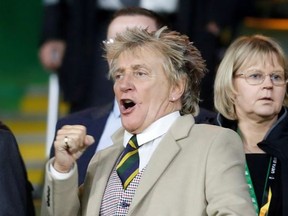 Rod Stewart reacts in the stands during the match.