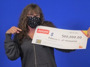 Rebecca Cole, of Newmarket, with her lotto winnings.