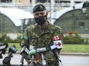 Canadian Forces Lt.-Col. Franz Kirk speaks to media outside a Mobile Health Unit at Sunnybrook Hospital on Friday, April 30, 2021.