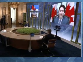Canadian PM Justin Trudeau, right, speaks during the virtual Leaders Summit on Climate in a video screenshot on Thursday, April 22, 2021.