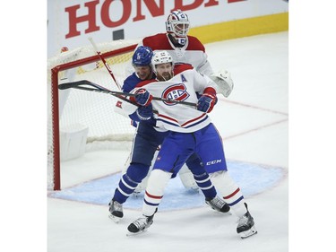 Montreal Canadiens Jeff Petry D (26) and Toronto Maple Leafs Zach Hyman C (11) spar in front of the net during the first period in Toronto on Wednesday April 7, 2021. Jack Boland/Toronto Sun/Postmedia Network