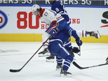 Montreal Canadiens Josh Anderson RW (17) jumps over Toronto Maple Leafs John Tavares C (91) during the second period in Toronto on Wednesday April 7, 2021. Jack Boland/Toronto Sun/Postmedia Network