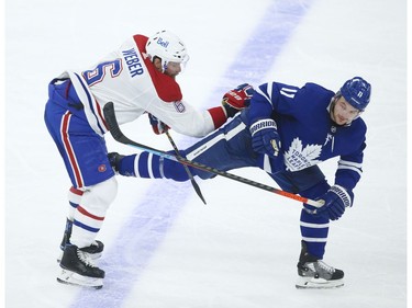 Montreal Canadiens Shea Weber D (6) checks Toronto Maple Leafs Zach Hyman C (11) during the third period in Toronto on Wednesday April 7, 2021. Jack Boland/Toronto Sun/Postmedia Network